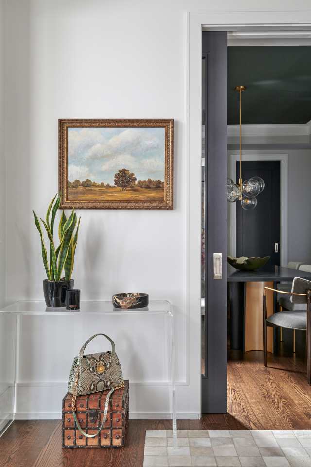 quiet luxury styled entryway with artwork and timeless pieces